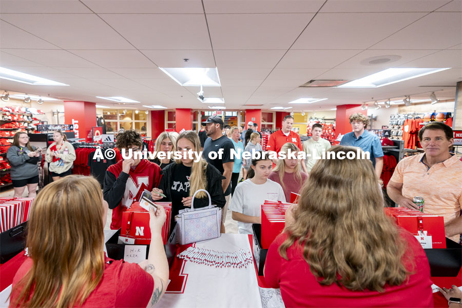 High school students check-in alongside their parents inside the Nebraska Union during Red Letter Day. September 13, 2024. Photo by Jordan Opp for University Communication.